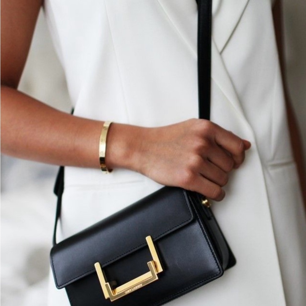 Yves Saint Laurent Black Crossbody Bag with Structured Design and Gold Hardware